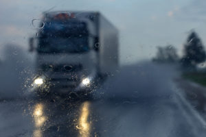 Truck on wet rainy freeway